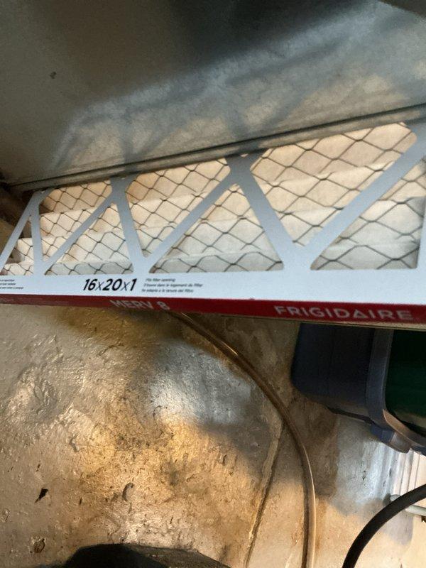 Completed comprehensive cooling maintenance on two 15-year-old central air conditioning systems, with one unit located in the attic and one in the basement. Performed standard tune-up procedures on both systems including inspection of all components, replaced Frigidaire 16x20x1 air filter on attic unit, verified proper airflow through pleated media, and inspected condensate drainage lines. Examined outdoor condenser unit with beige casing and cylindrical fin arrangement, confirmed fan operation with protective wire guard intact, and verified unit mounted securely on concrete pad with adequate clearance from surrounding vegetation. Both systems tested and confirmed operational with no deficiencies noted at time of service.