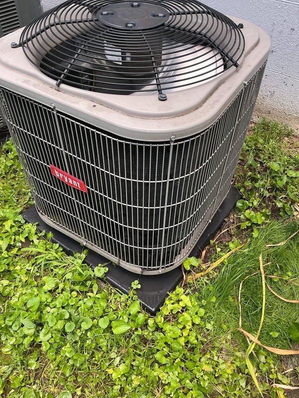Completed comprehensive cooling maintenance on two 15-year-old central air conditioning systems, with one unit located in the attic and one in the basement. Performed standard tune-up procedures on both systems including inspection of all components, replaced Frigidaire 16x20x1 air filter on attic unit, verified proper airflow through pleated media, and inspected condensate drainage lines. Examined outdoor condenser unit with beige casing and cylindrical fin arrangement, confirmed fan operation with protective wire guard intact, and verified unit mounted securely on concrete pad with adequate clearance from surrounding vegetation. Both systems tested and confirmed operational with no deficiencies noted at time of service.
