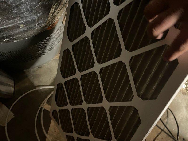 # HVAC Tune-Up Completed

Performed comprehensive AC tune-up service on residential HVAC system, including inspection of blower motor assembly and air filter. Documented existing dust and debris accumulation on blower wheel and hexagonal grid air filter, indicating normal operational wear. System components including electrical connections, motor assembly, and air handler cabinet were inspected and found to be functioning properly.