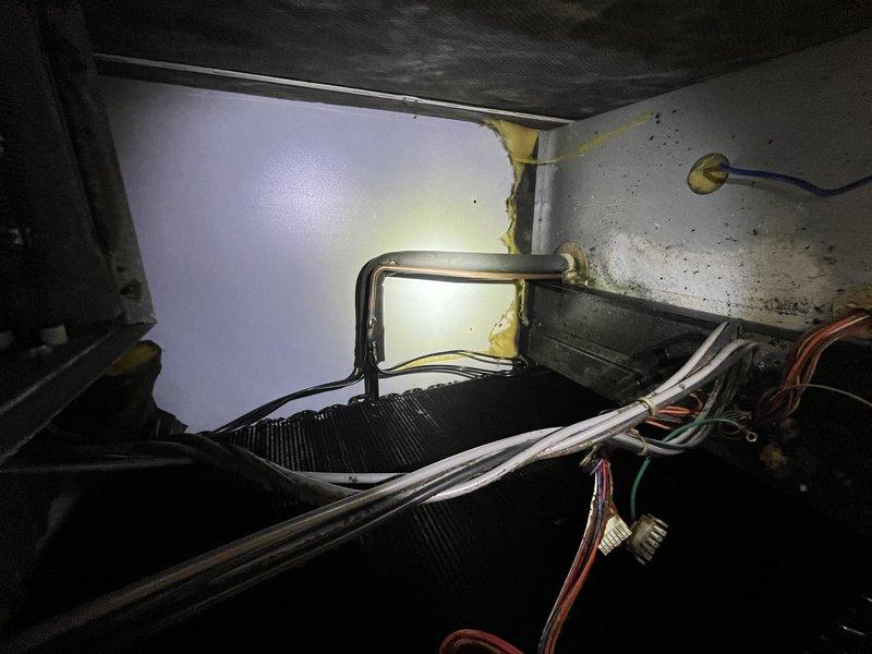 Replaced failed evaporator coil on geothermal heat pump system (serial UK1967). Removed and disposed of old coil, installed new Water Furnace evaporator coil, reconnected refrigerant lines and electrical connections, and verified proper system operation. Unit restored to full functionality with new coil properly installed and secured within air handler cabinet.