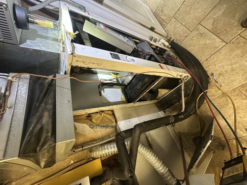 Replaced failed evaporator coil on geothermal heat pump system (serial UK1967). Removed and disposed of old coil, installed new Water Furnace evaporator coil, reconnected refrigerant lines and electrical connections, and verified proper system operation. Unit restored to full functionality with new coil properly installed and secured within air handler cabinet.