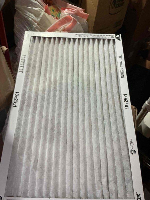 Completed comprehensive AC tune-up on 8-year-old ground-level condenser unit per Home Depot maintenance program specifications. Performed standard preventive maintenance procedures including system inspection, refrigerant level verification, electrical connection testing, condensate drain check, and airflow assessment. Inspected and documented 16x25x1 air filter showing moderate dust accumulation and equipment nameplate data for Central Air Conditioner model CAPF3636B0CB with visible condensation on exterior housing indicating normal operational conditions.