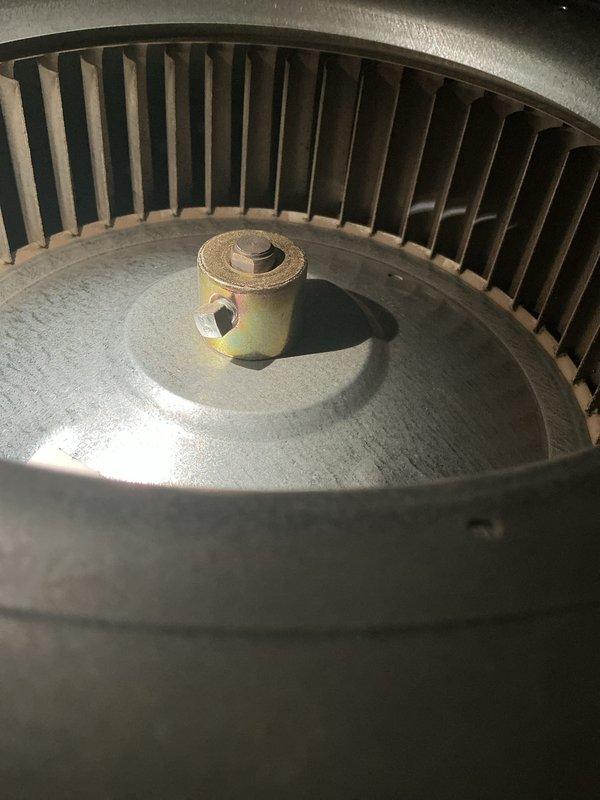 Completed comprehensive cooling system tune-up on 13-year-old air conditioning unit located in backyard. Performed standard maintenance procedures including inspection and cleaning of blower wheel assembly, which showed typical dust accumulation for unit age. Verified electrical performance using clamp meter to measure voltage and amperage, confirming system is operating within manufacturer specifications.