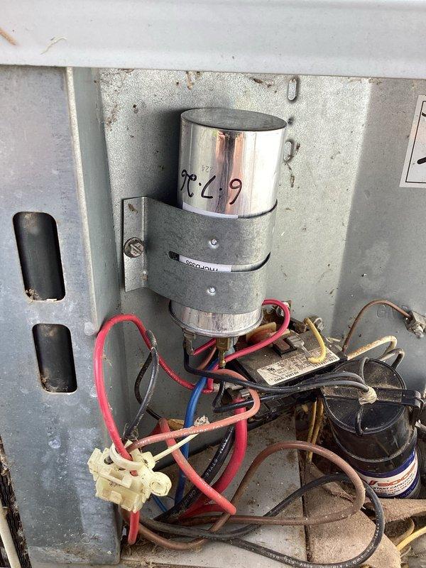 Responded to no cooling complaint on 2013 residential AC unit unable to maintain 74-degree setpoint. Upon inspection, found evaporator coil heavily clogged with dirt and debris causing restricted airflow and reduced cooling capacity. Removed and cleaned coil, inspected capacitor and electrical connections which appeared functional, and restored system to proper operation with adequate cooling performance.