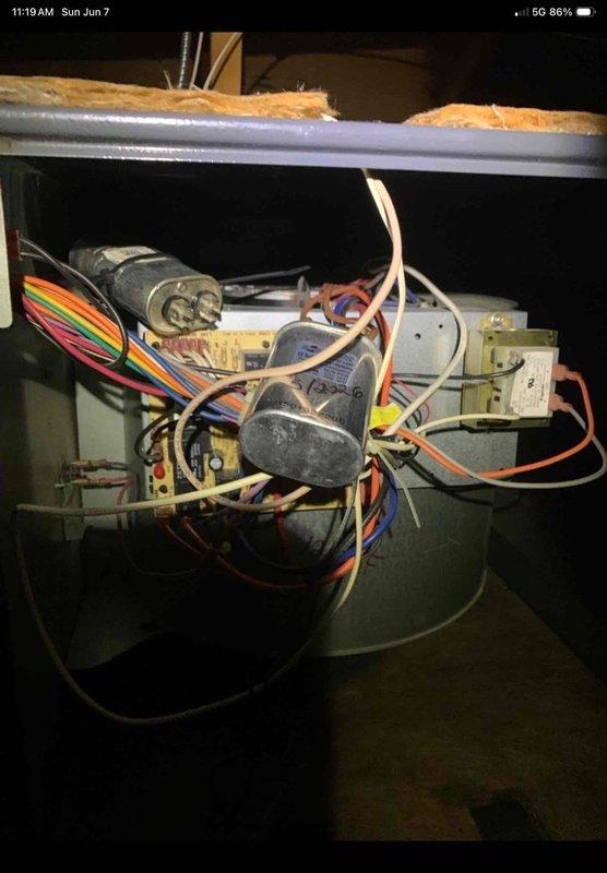 Responded to warranty callback for 15-year-old Lennox AC system serving space over garage with no cooling approximately one week following capacitor replacement by our company. Upon arrival, performed comprehensive system diagnostics including visual inspection of outdoor condensing unit and indoor air handler components. Verified all electrical connections at capacitor, contactor, and compressor terminals for proper seating and integrity. Tested voltage and amperage readings at compressor and condenser fan motor to confirm proper operation. Inspected refrigerant line connections for leaks or damage. Checked thermostat operation and verified proper communication between indoor and outdoor units. Examined blower motor assembly and associated wiring harness for any loose connections or damage that may have occurred during previous service visit. System tested and cycled multiple times to ensure reliable operation and proper cooling output restored to affected zone.