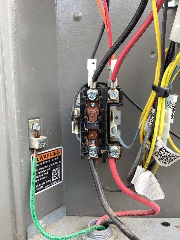 Responded to callback for frozen evaporator coil on outdoor unit 10. Upon arrival, confirmed coil was previously frosted over and unit had been shut off with fan running to facilitate defrost. Accessed electrical panel and inspected contactor, wiring connections, and control components for proper operation. Connected manifold gauge set to refrigerant lines and verified system pressures and charge levels. All electrical connections secure, refrigerant charge within specification, and system operating normally after defrost cycle completed. Photographed electrical panel configuration and gauge readings for documentation.