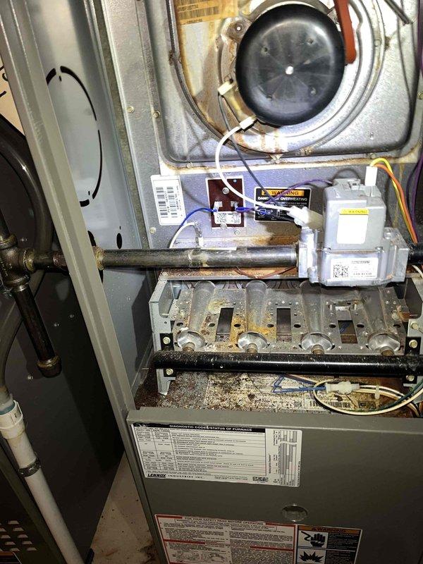 Responded to no cooling complaint on main floor Lennox air conditioning system. Upon inspection, discovered evaporator coil had severe foam insulation failure with material expanding and protruding from the air handler cabinet, causing significant airflow restriction. The deteriorated insulation was blocking airflow across the coil, preventing proper heat exchange and resulting in loss of cooling capacity. Documented conditions with photographs showing foam material extruding from coil assembly and overall system configuration. Advised customer of findings and provided options for repair, including evaporator coil replacement and proper resealing of air handler cabinet to restore system efficiency and cooling performance.
