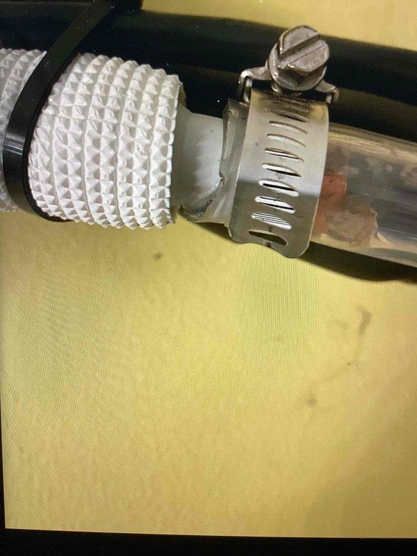 Responded to recall for condensate drain line leak caused during previous maintenance visit. Inspected condensate drainage system and identified improperly secured connection between flexible drain hose and rigid drain pipe. Reinstalled and properly secured condensate line connections using appropriate hose clamps, ensuring watertight seal at all junction points. Verified condensate drainage system functioning correctly with no leaks present. System tested and returned to normal operation.