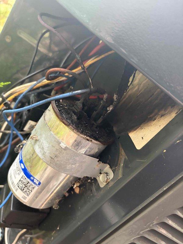 Responded to no-cooling call on 10+ year old outdoor unit where indoor fan was operating but compressor would not engage. Upon inspection, found severely deteriorated line set insulation with heavy frost accumulation indicating refrigerant flow issues and possible low charge condition. Examined electrical components and capacitor connections, noting dusty conditions consistent with unit age. Advised customer to keep system off to prevent compressor damage and provided diagnostic findings with repair recommendations for capacitor replacement and refrigerant system service.