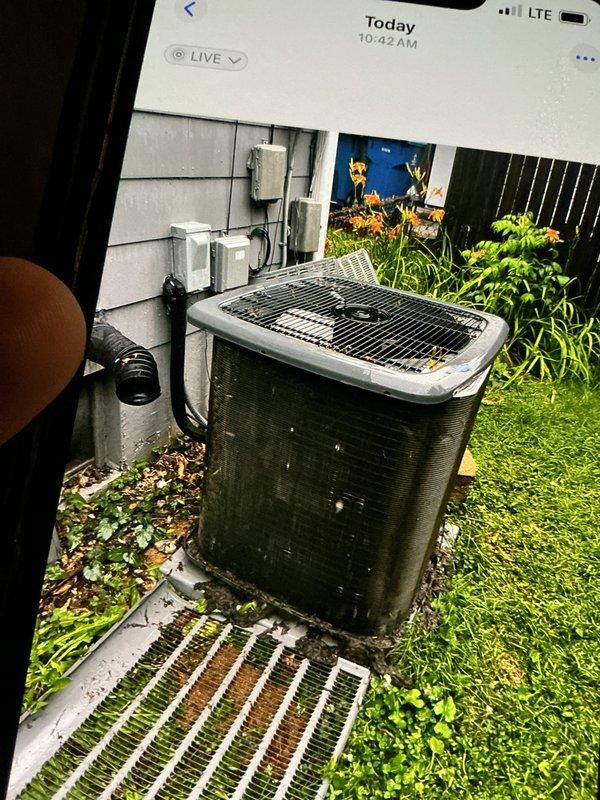 Responded to no cooling call on 10+ year old ground-level unit located at rear of residence. Upon arrival, found outdoor condensing unit with significant exterior corrosion and deterioration on cabinet panels. Performed system diagnostics and troubleshooting to identify cause of cooling failure. Documented equipment condition with photos showing advanced rust on metal casing and components, indicating unit age and exposure to weather elements over extended service life.