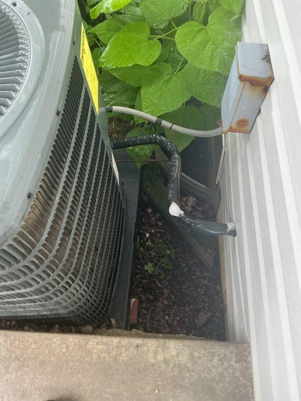 Responded to service call for refrigerant line leak at outdoor condenser unit on 9-year-old air conditioning system. Upon inspection, discovered deteriorated foam insulation on suction line near compressor connection point, causing moisture accumulation and insulation breakdown. Assessed refrigerant lines running from condenser unit, examined both liquid and suction line insulation integrity, and documented existing conditions. Inspected condenser unit operation, verified proper airflow through coil fins, and checked for additional signs of refrigerant loss or system degradation.