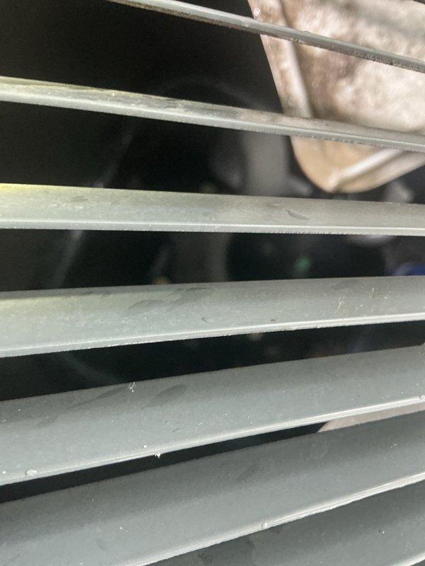 Responded to service call for refrigerant line leak at outdoor condenser unit on 9-year-old air conditioning system. Upon inspection, discovered deteriorated foam insulation on suction line near compressor connection point, causing moisture accumulation and insulation breakdown. Assessed refrigerant lines running from condenser unit, examined both liquid and suction line insulation integrity, and documented existing conditions. Inspected condenser unit operation, verified proper airflow through coil fins, and checked for additional signs of refrigerant loss or system degradation.