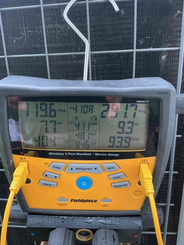 Responded to no cooling call with ice formation on evaporator coil. Upon arrival, found 9-year-old AC system with frozen evaporator coil. Connected SMAN460 manifold gauge to system and recorded operating pressures and temperatures. Suction pressure reading of 196 PSIG and discharge pressure of 287.7 PSIG indicated system operating conditions. Superheat and subcooling values were analyzed to diagnose airflow restriction causing coil icing. Inspected evaporator coil assembly and identified reduced airflow across coil fins as primary cause of freezing condition. System was shut down to allow ice to melt from coil surface. Recommended filter replacement and verification of proper airflow once coil has fully thawed to restore normal cooling operation.