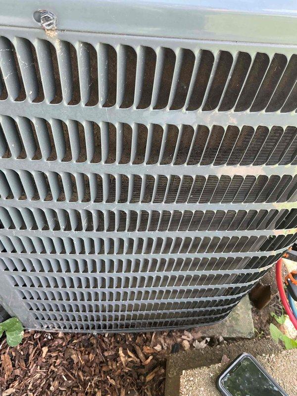 Completed comprehensive AC tune-up on 2019 residential split system unit located at side of home. Performed standard maintenance protocol including inspection of condenser coil which showed moderate dirt and debris accumulation between aluminum fins, and evaluated used air filter displaying significant dust buildup in pleated media requiring replacement. All system components were inspected and unit returned to proper operating condition per manufacturer specifications.