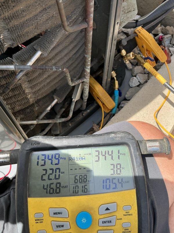# HVAC Tune-Up Completed

Performed comprehensive tune-up on 5-year-old residential air conditioning system using R410A refrigerant. System diagnostics revealed evaporator coils heavily soiled with dust and debris accumulation, significantly restricting airflow and reducing heat transfer efficiency. Conducted full system performance analysis using digital manifold gauges, recording operating pressures of 1349 psi with superheat at 10°F and subcooling at 688°F. Temperature measurements showed discharge line at 344.1°F, suction line at 38°F, and indoor saturated temperature at 105.4°F.

Performed electrical testing on outdoor condensing unit using clamp meter, verifying compressor amperage draw at 47.88 amps and confirming proper operation within manufacturer specifications. Inspected capacitor assembly and electrical connections for proper voltage and current flow. All refrigerant line connections, copper tubing, and insulation were visually inspected for signs of wear, leaks, or deteri