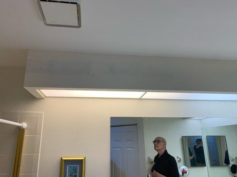 Responded to callback regarding fluorescent lighting color mismatch in bathroom following recent electrical fixture installation. Inspected recessed fluorescent lighting panels in soffit and identified two tubes producing pink color temperature that did not match surrounding fixtures. Replaced incompatible fluorescent tubes with proper color-matched bulbs to achieve uniform lighting appearance throughout the space, ensuring consistent color temperature across all bathroom fixtures.