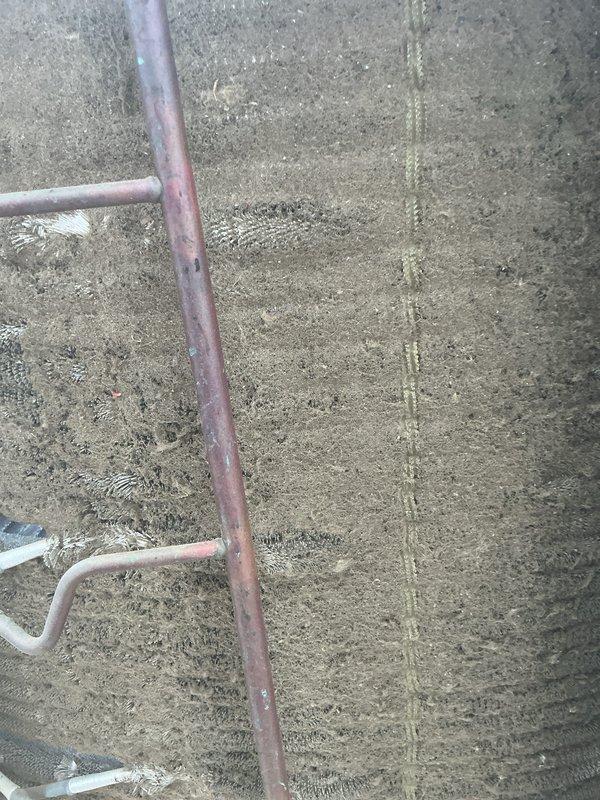 Responded to no cooling complaint at residential property. Upon inspection, found outdoor condenser coil heavily contaminated with dirt, dust, and debris accumulation, significantly restricting airflow through the unit. Performed thorough coil cleaning to restore proper heat exchange function and system operation.