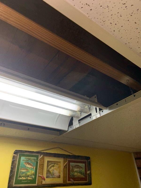 Responded to service call for multiple electrical issues including non-functional water heater traced to electrical panel problem, replaced bathroom light fixture, resolved flickering bedroom light, and diagnosed basement fluorescent fixture that remained inoperative after customer's tube replacement attempt. Inspected and serviced main electrical panel, addressing circuit breaker connections affecting water heater operation, and completed fixture replacements and lighting repairs throughout residence.