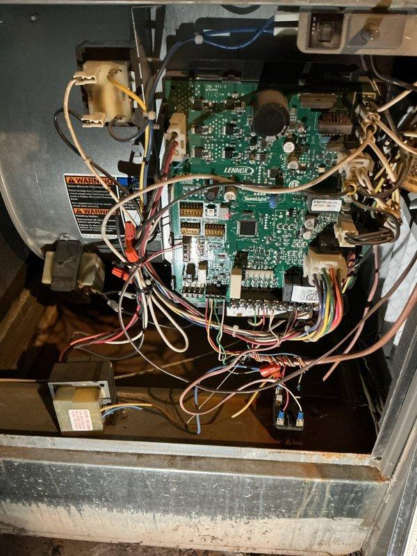 Responded to service call for furnace inspection following recent sewage backup incident in basement. Performed thorough visual inspection of furnace control board, wiring harnesses, and internal components for water damage or contamination. Examined Lennox circuit boards, electrical connections, transformers, and all accessible wiring for signs of moisture intrusion or sewage exposure. Verified all wire connections, terminal blocks, and safety controls were intact and functioning properly. Inspected furnace exterior cabinet and base for evidence of water contact or deterioration. All components appeared dry with no visible signs of sewage damage or moisture-related issues. System operational and safe for continued use.