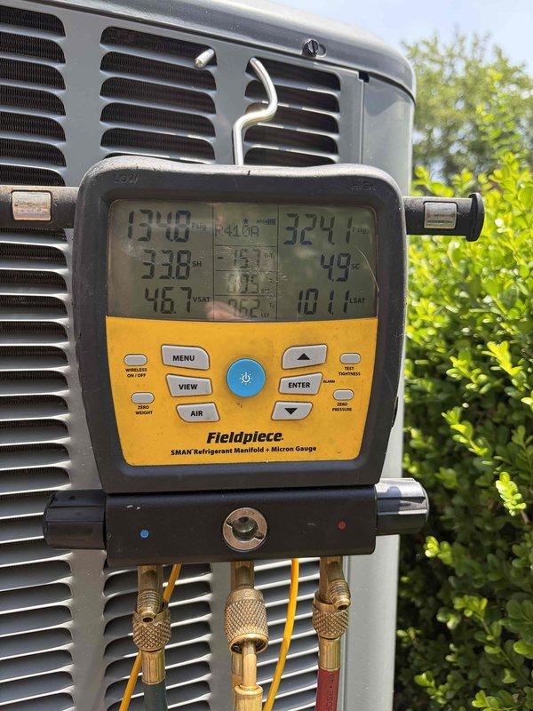 Completed comprehensive cooling system tune-up on single residential air conditioning unit less than 10 years old located at front of property. Performed standard maintenance protocol including inspection of condenser coil fins, verification of refrigerant pressures and temperatures using digital manifold gauges, and system performance evaluation. All components found operating within normal parameters with no deficiencies noted requiring immediate attention.
