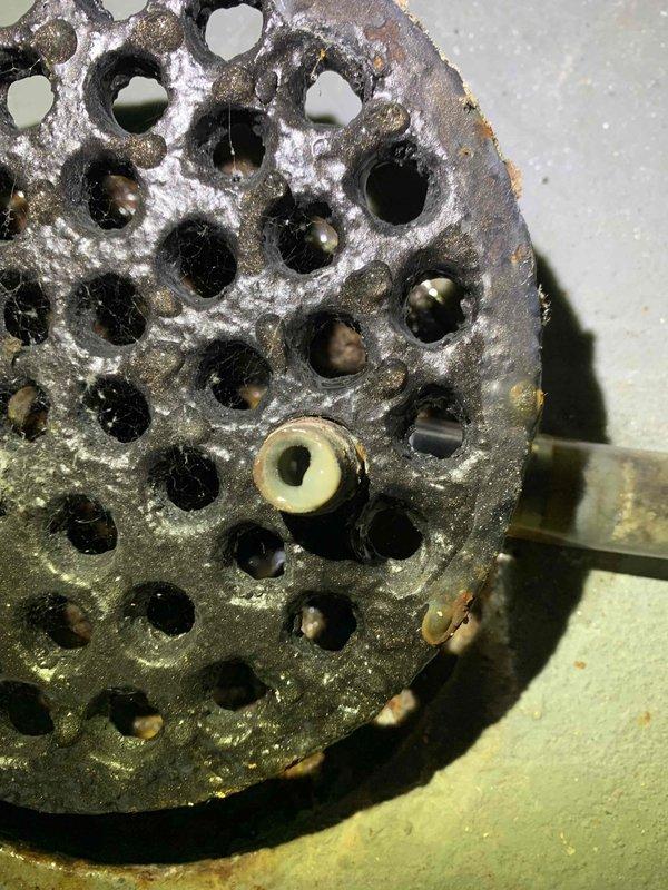 Responded to callback for system failure following previous service visit. Upon arrival, found unit had been shut off per instructions. Inspected burner assembly and discovered severely corroded burner with heavy buildup and oxidation preventing proper operation. The deteriorated condition indicated the burner was at end of service life and required immediate replacement for safe system operation. Checked system control board alert history, which showed no active fault codes. Explained findings and recommended burner replacement to restore heating function.