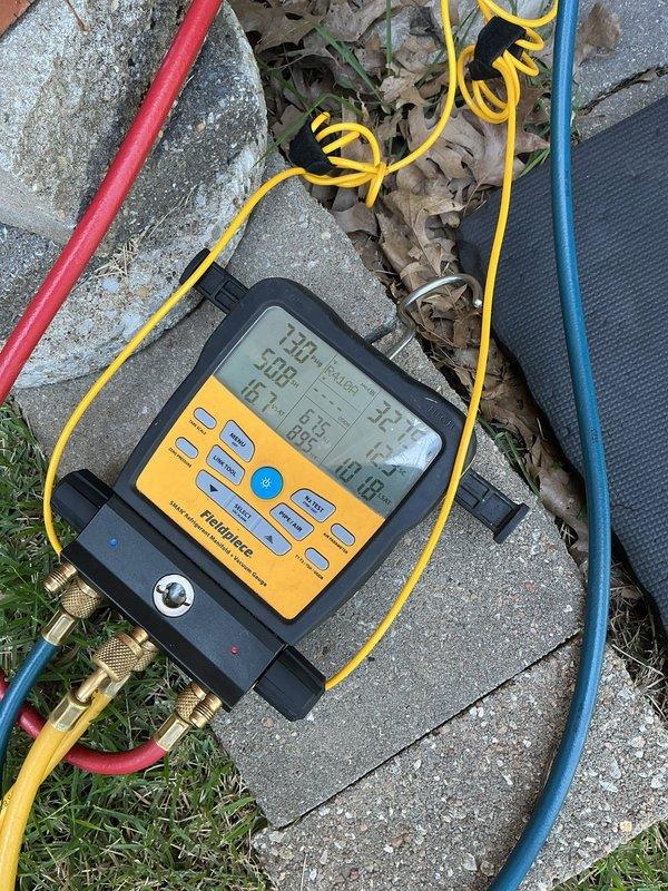 Responded to no cooling complaint on 10+ year old outdoor unit located on side of home. Upon arrival, performed diagnostic testing using digital manifold gauges to assess system pressures and temperatures. Inspection revealed aged evaporator coil with significant oxidation on copper tubing and compressor assembly showing wear consistent with unit age. Conducted electrical testing and verified motor operation. System components displayed normal wear patterns for equipment of this age. Documented internal cabinet condition with visible heat exchanger, copper refrigerant lines, and compressor motor assembly. Completed full system diagnostics and provided customer with findings and recommendations for aged equipment.