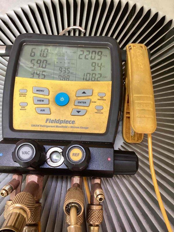 Responded to no-cool emergency service call for aging air conditioning system with non-operational outdoor unit. Upon arrival, performed comprehensive diagnostic testing using digital manifold gauges to assess refrigerant pressures, temperatures, and system performance across the condenser coil and heat exchanger components. Measurements revealed abnormal pressure readings and temperature differentials indicating potential compressor failure or electrical control issues preventing outdoor unit from engaging. Documented system conditions with detailed photos of diagnostic equipment readings showing operating temperatures and pressures at various test points on the condenser unit to establish baseline system performance data for repair recommendations.