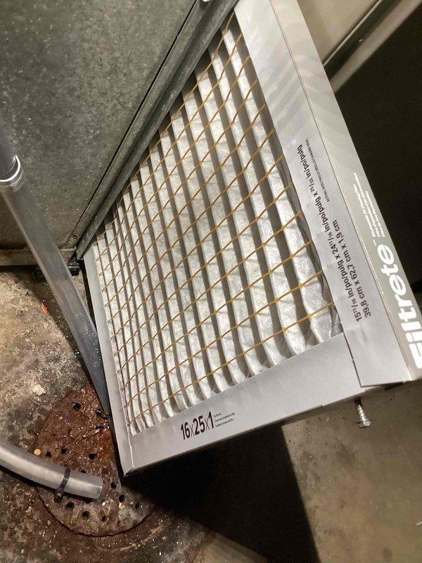 Responded to service call for outdoor condenser unit producing abnormal buzzing noise. Upon inspection, found condenser coils heavily contaminated with dirt, dust, and debris buildup restricting airflow and causing operational stress. Thoroughly cleaned condenser coils and fins, removing accumulated environmental contaminants. Replaced dirty air filter with new unit. Tested system operation following cleaning—buzzing noise eliminated and unit operating normally within manufacturer specifications.