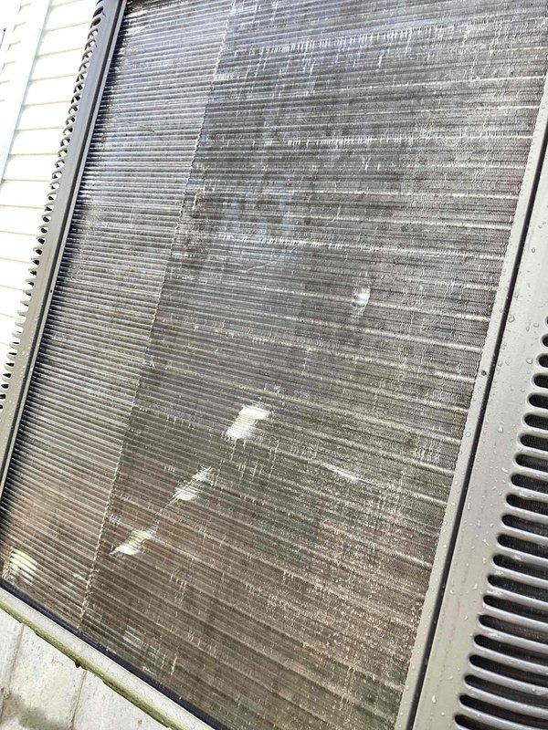 Responded to service call for outdoor condenser unit producing abnormal buzzing noise. Upon inspection, found condenser coils heavily contaminated with dirt, dust, and debris buildup restricting airflow and causing operational stress. Thoroughly cleaned condenser coils and fins, removing accumulated environmental contaminants. Replaced dirty air filter with new unit. Tested system operation following cleaning—buzzing noise eliminated and unit operating normally within manufacturer specifications.