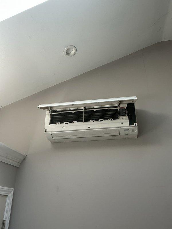 Performed scheduled maintenance on ductless mini-split air conditioning system. Opened unit cover to access internal components, inspected air filter and blower assembly for cleanliness and proper operation. Verified system functionality and closed unit upon completion of maintenance procedures.