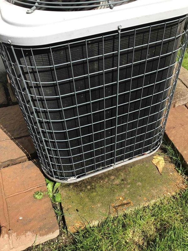 Completed preventative maintenance tune-up on a 10-year-old residential air conditioning system located in the backyard. Replaced heavily soiled air filter that showed significant dust and debris accumulation across the filtration media. Inspected outdoor condenser unit, noting algae growth on concrete pad and vegetation encroachment around the equipment base, with unit otherwise operating within normal parameters.