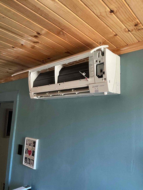 Responded to service call for ductless mini-split system not cooling bedroom and displaying 2-blink error code indicating indoor coil thermostat error. Upon arrival, accessed indoor air handler by opening front cover to inspect evaporator coil assembly and internal components. Diagnosed thermostat sensor malfunction affecting communication between indoor unit and temperature control system, preventing proper cooling operation.