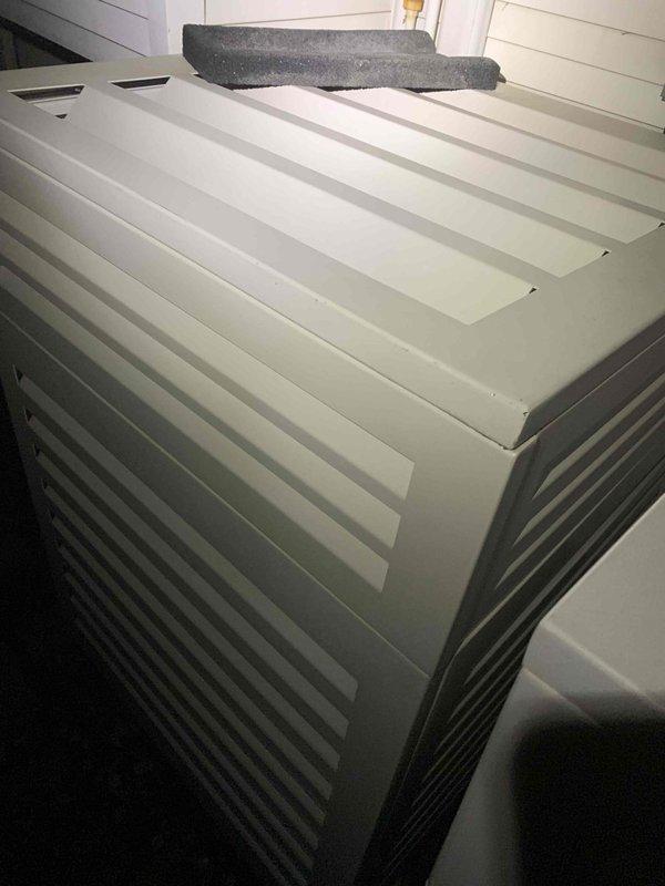 Arrived on-site for scheduled service call but job was cancelled after dispatch. Documented existing HVAC system configuration including air handler unit with horizontal slat panels and vertical louvers, along with associated PVC condensate drain piping assembly featuring multiple elbows, foam pipe insulation, and flexible discharge line in utility area. No work performed due to cancellation.