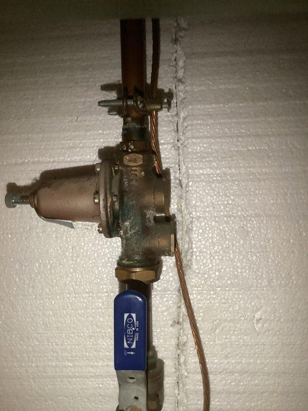 Replaced existing water heater with new 50-gallon electric tall residential unit in basement location. Installation included mounting new tank, connecting insulated hot and cold water lines with proper copper piping, and installing 3/4" pressure reducing valve (PRV) with shutoff valve on incoming water supply. Verified all connections for proper operation, ensured thermal expansion accommodation, and confirmed unit functionality upon completion.