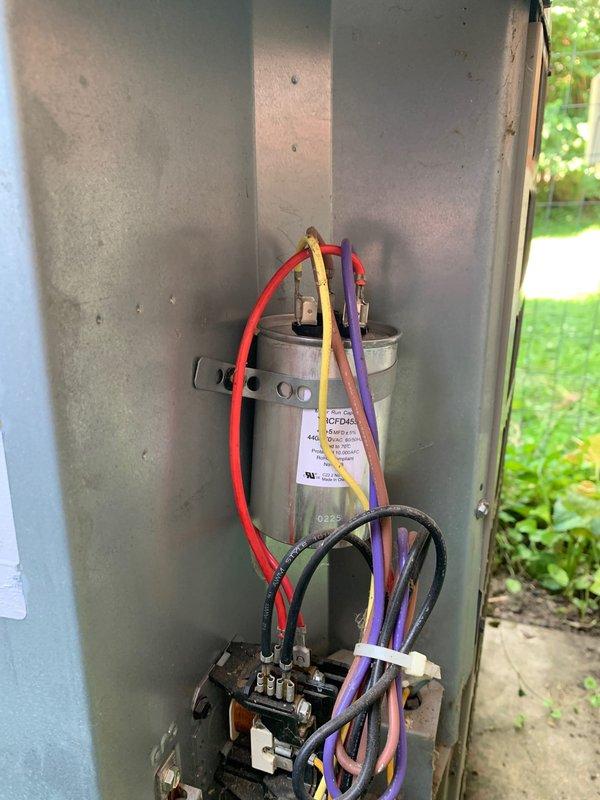 Responded to no cooling call for ground-level residential condenser unit. Upon inspection, found failed dual run capacitor preventing compressor and condenser fan motor operation, causing unit to blow warm air only. Replaced defective capacitor with proper rated replacement, verified all electrical connections secure, and tested system operation. Unit now cooling properly with compressor and fan motor running within normal parameters.