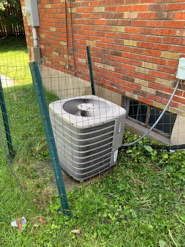 Responded to no cooling call for ground-level residential condenser unit. Upon inspection, found failed dual run capacitor preventing compressor and condenser fan motor operation, causing unit to blow warm air only. Replaced defective capacitor with proper rated replacement, verified all electrical connections secure, and tested system operation. Unit now cooling properly with compressor and fan motor running within normal parameters.