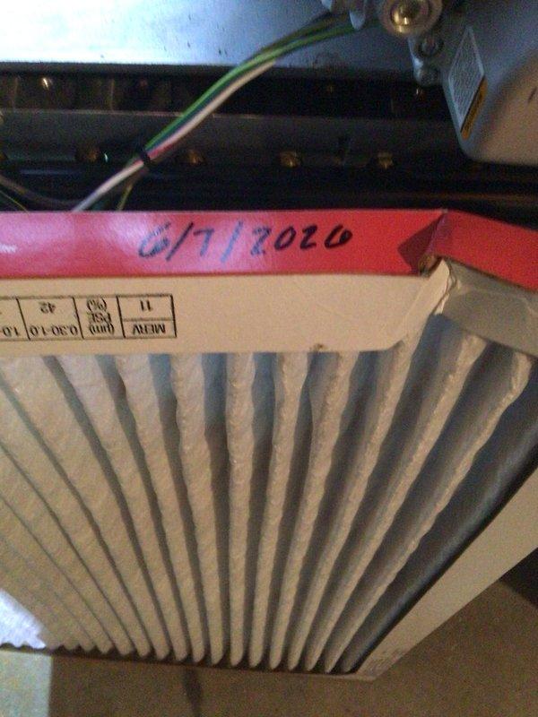 Completed comprehensive cooling maintenance on a 9-year-old air conditioning system. Performed standard tune-up procedures including inspection of electrical components, control board, and wiring connections within the unit's control panel. Evaluated and documented air filter condition, noting previous maintenance date marking. System tested and confirmed operational with all components functioning properly.