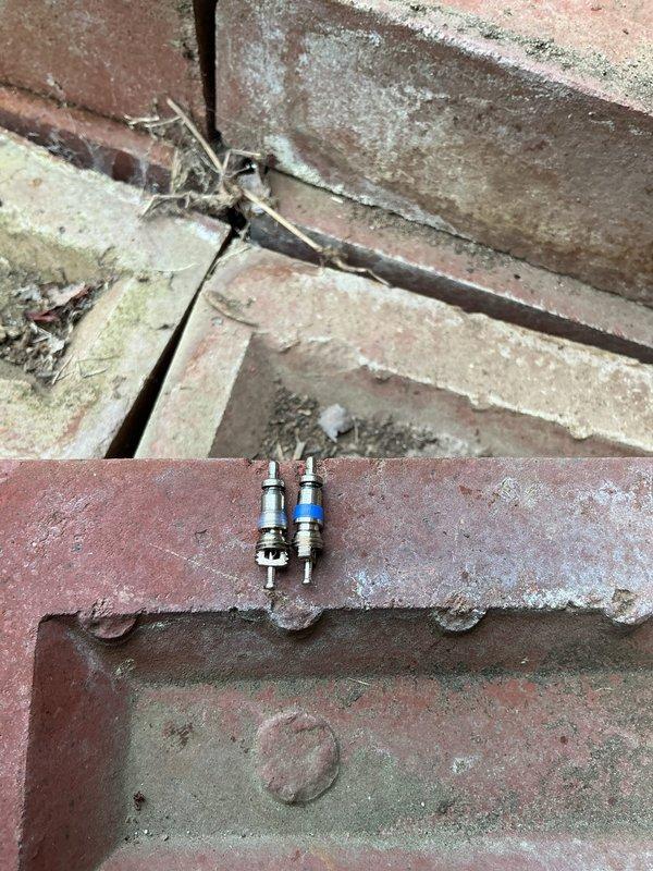 Replaced defective Schrader core on HVAC system and recharged refrigerant to proper operating levels. Removed failed core from service port, installed new core from stock, and added required pounds of refrigerant to restore system capacity. System tested and verified operational upon completion.