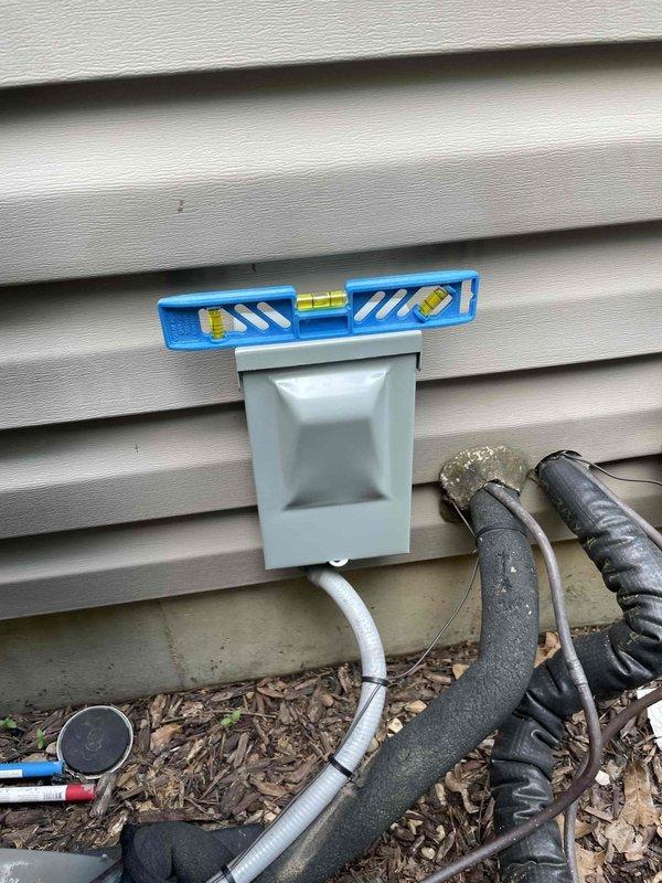Replaced defective fused disconnect box with new unit equipped with 35-amp fuses on residential HVAC system. Unit was verified to be properly leveled and secured to exterior wall, with all electrical connections completed per code. System tested and confirmed operational for both heating and cooling functions.