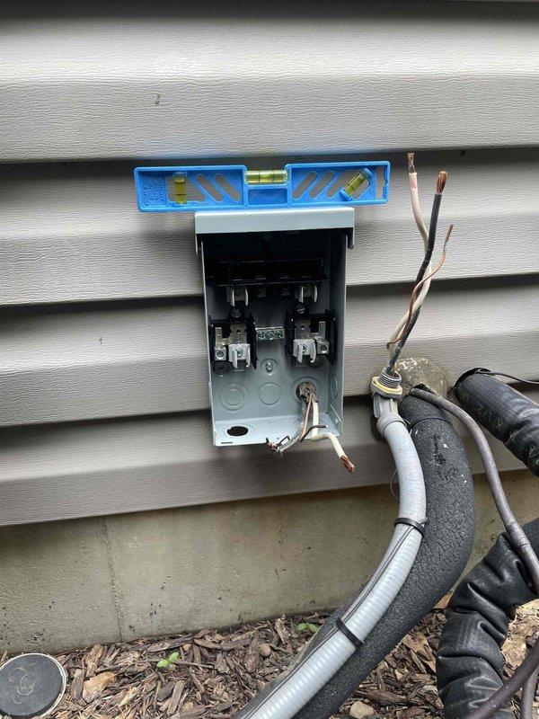 Replaced defective fused disconnect box with new unit equipped with 35-amp fuses on residential HVAC system. Unit was verified to be properly leveled and secured to exterior wall, with all electrical connections completed per code. System tested and confirmed operational for both heating and cooling functions.
