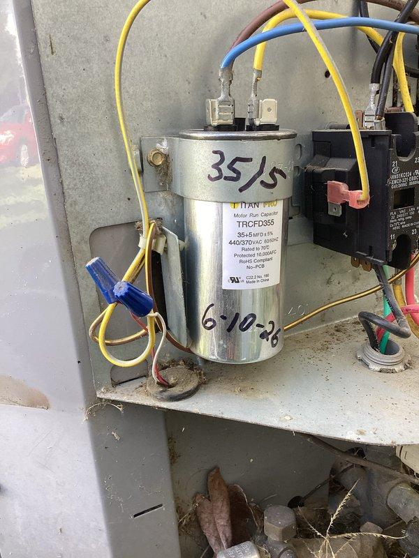 # HVAC Service Completed

Responded to no-cooling call where condenser unit would not turn on. Upon arrival, performed diagnostic testing of the outdoor unit's electrical system. Pressure readings indicated system had refrigerant charge present. Investigation of the control panel revealed a failed dual-run capacitor rated at 35/5 MFD. Replaced defective capacitor with new TITAN PRO TRCFD3554 unit matching original specifications. Verified proper electrical connections to compressor and condenser fan motor circuits. Tested system operation and confirmed condenser unit now starting properly with normal amp draws. Unit restored to full cooling operation.