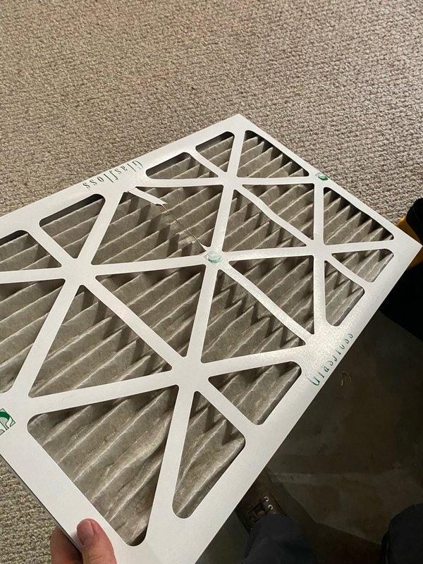 Completed comprehensive air conditioning tune-up on single residential unit located in basement with raised installation. Performed standard maintenance procedures including temperature verification, recording 76.6°F supply air temperature, and inspected refrigerant lines showing normal copper oxidation with proper insulation. Replaced dirty air filter with visible dust accumulation to restore proper airflow and system efficiency.