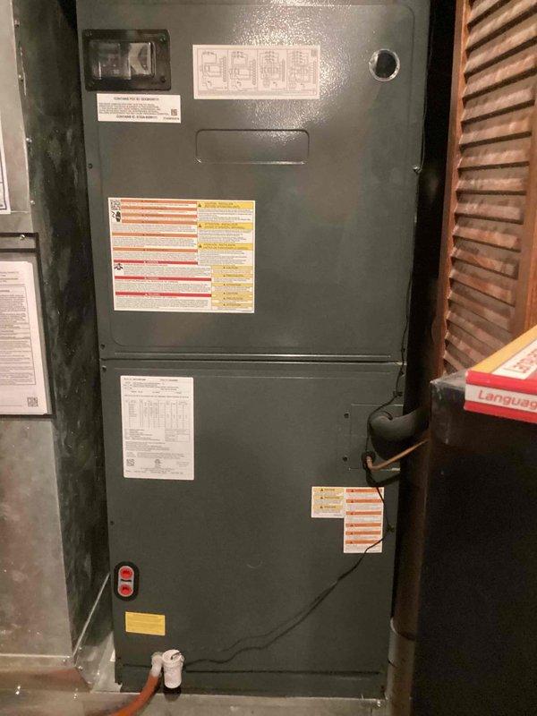 Responded to no cool call with thermostat displaying blank screen and no power. Upon arrival, found multiple thermostats installed on wall including non-functional Honeywell ProSeries unit. Diagnosed issue as loss of 24V power to thermostat from furnace control board. Inspected 10+ year old gray furnace unit located in ground-level utility area and verified proper voltage supply, traced wiring, and restored power to thermostat. System tested successfully with thermostat now displaying proper temperature readings and unit responding to cooling commands.