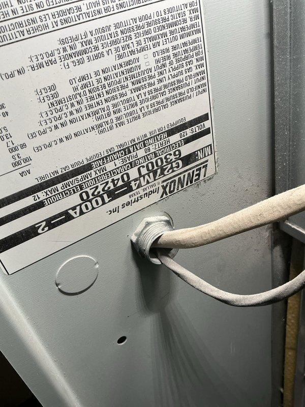 Responded to no cooling complaint on 10+ year old Lennox CustomHeat system located at rear of residence. Upon arrival, performed diagnostic evaluation of furnace and connected HVAC components. Inspected unit specifications, verified proper connections of refrigerant lines and condensate piping, and assessed overall system operation. Documented equipment condition with detailed photography of manufacturer labels, unit configuration, and installation setup including water heater integration. System evaluated and findings communicated to customer for resolution of cooling issue.