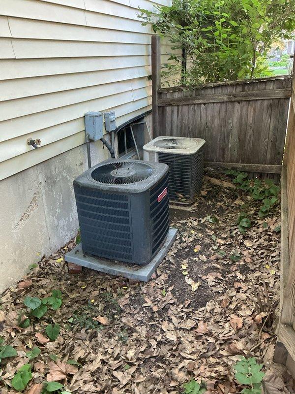 Responded to no cooling complaint for multi-zone system serving second and third floors. Upon arrival, found outdoor condenser unit operational but covered with debris and organic matter accumulation affecting airflow and heat transfer efficiency. Cleaned condenser coils, removed leaf debris from unit base and surrounding area, and cleared obstructions from cooling fins. Verified proper system operation, confirmed adequate cooling output, and restored normal temperature control to affected zones.