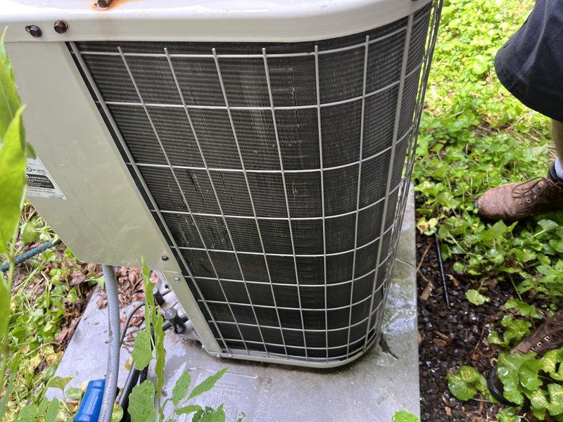 Responded to no-cooling complaint with unit running continuously and unable to maintain temperature below 81°F. Upon arrival, performed diagnostic assessment of 10-year-old air conditioning system. Inspected outdoor condenser unit and found operational compressor and fan motor. Accessed indoor air handler and discovered severely corroded evaporator coil with extensive rust and oxidation throughout the fin assembly. Copper refrigerant lines showed significant deterioration and corrosion. The degraded coil condition was restricting airflow and heat transfer capacity, preventing adequate cooling performance. Documented equipment condition with photographs showing the extent of corrosion damage to both the evaporator coil and refrigerant piping. Advised that the corroded evaporator coil has failed and requires replacement to restore proper system operation and cooling capacity.