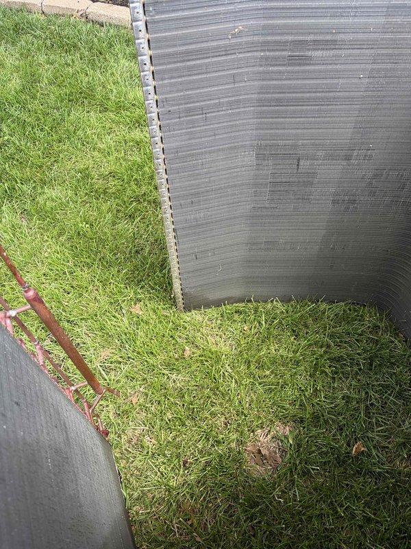 Replaced failed condenser coil on residential outdoor air conditioning unit. Removed top cover to access internal components, disconnected refrigerant lines from compressor, and extracted old condenser coil assembly. Installed new condenser coil with proper refrigerant line connections to compressor. Disposed of defective coil per standard procedures. Unit restored to operational condition.
