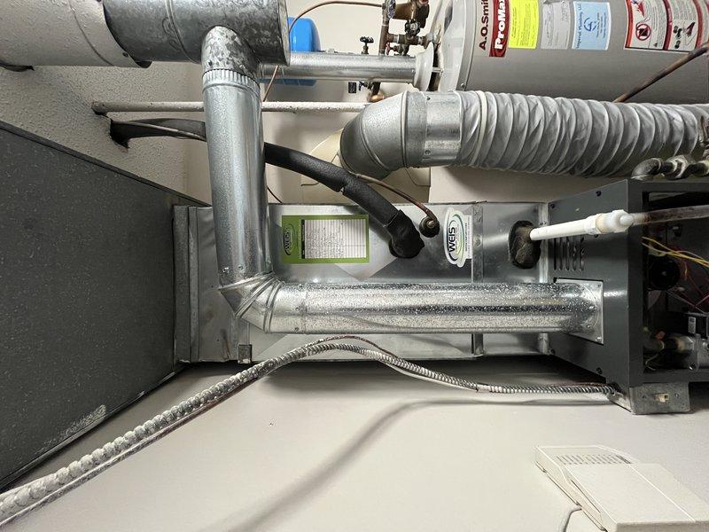Responded to service call for air conditioning system operating with excessive noise levels. Upon arrival, performed comprehensive inspection of Daikin HVAC system including air handler unit and associated ductwork in mechanical room. Evaluated system components, flexible ductwork connections, and condensate management. Documented equipment condition with photographs showing proper installation of air handler, ductwork configuration, and moisture accumulation on metallic duct sections. Advised customer on system operation and recommended unit shutdown until further assessment could be completed to prevent potential component damage from continued operation under current conditions.