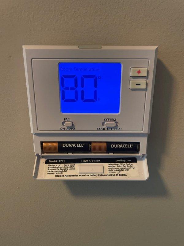 Responded to callback for cooling system not reaching set temperature. Upon arrival, found outdoor disconnect switch in OFF position at side yard unit. Verified thermostat set to 80°F and confirmed batteries operational. Reset disconnect to ON position and restored power to condensing unit. System energized successfully and began cooling cycle. Verified proper thermostat communication and compressor operation. Unit now functioning normally and cooling to desired setpoint.
