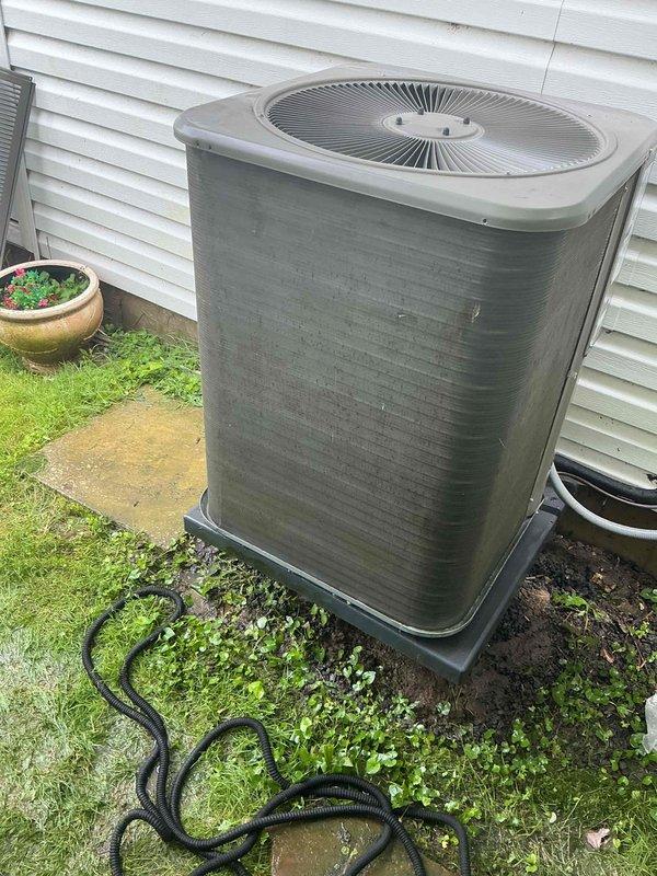 Responded to emergency service call for 10-year-old air conditioning system producing metal clunking sounds. Upon inspection, found outdoor condenser unit with severely clogged condenser coil covered in thick layers of dirt, dust, and debris accumulation, significantly restricting airflow and causing system strain. Performed thorough cleaning of condenser coil fins to restore proper airflow and heat transfer efficiency. Inspected fan motor and blades for source of clunking noise, verified fan operation and blade clearances. Checked refrigerant levels, electrical connections, and capacitor function. System restored to normal operation with improved airflow and no abnormal sounds detected during test run.